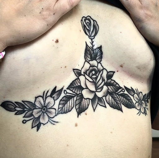 Explore dark hand tattoo ideas, creative tattoo ideas in Rutherfordton, available at Divine Arts Tattoo