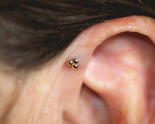 Explore candy skull tattoo ideas, creative tattoo ideas in Buffalo, available at Moria Piercing and Jewelry