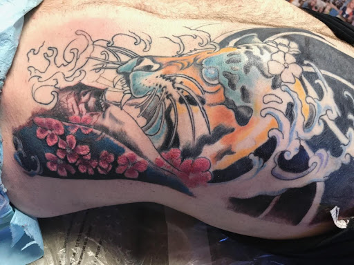 Explore banksy tattoo ideas, creative tattoo ideas in Casper, available at Ink Spot