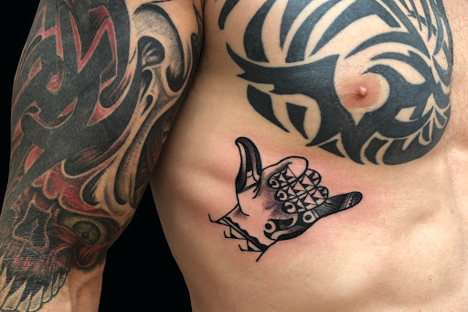 Explore finger tattoo ideas, creative tattoo ideas in Lahaina, available at Sweet Trade Tattoo