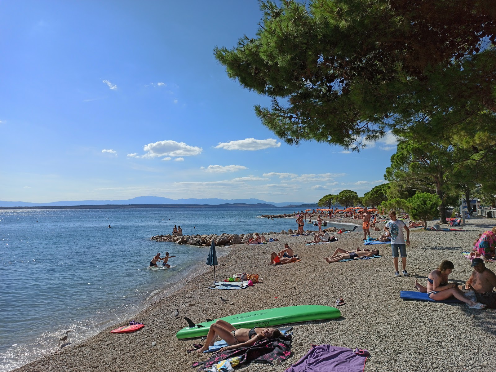 Photo of Crikvenica beach with turquoise pure water surface