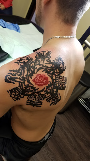 Explore flower tattoo cover up ideas, creative tattoo ideas in Peoria, available at Guerrilla Ink Tattoos