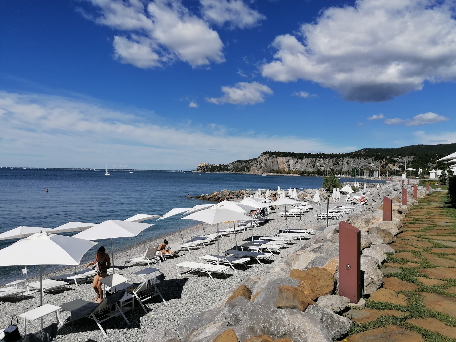 Fotografija Spiaggia di Portopiccolo Sistiana z visok stopnjo čistoče