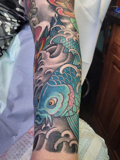 Explore honeybee tattoo ideas, creative tattoo ideas in Delray Beach, available at Vatican Tattoo Studio Delray