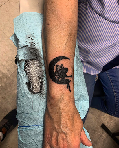 Explore squid tattoo ideas, creative tattoo ideas in Hudson Falls, available at ALTERED ADDICTION TATTOOS