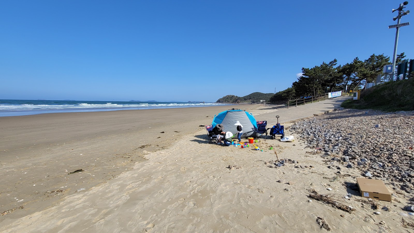 Fotografie cu Baggae Beach cu o suprafață de nisip beige