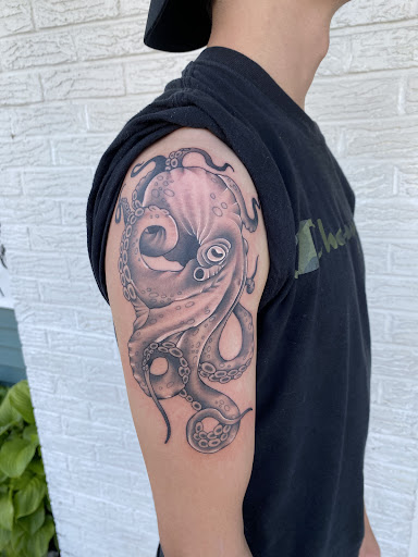 Explore mom & son tattoo ideas, creative tattoo ideas in Erie, available at Wayward Tattoo Studio