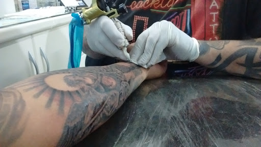 Logo da empresa - Alienígena Tattoo Shop