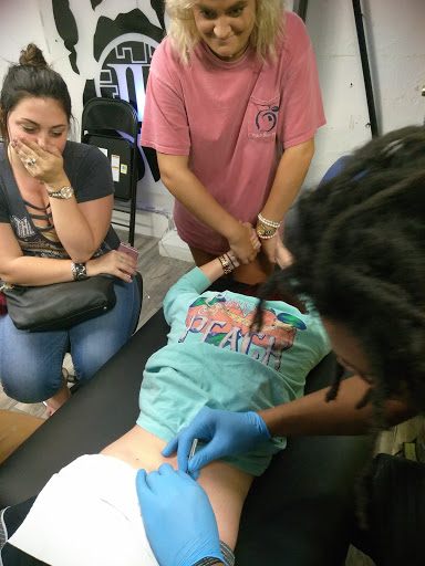 Explore trapezius tattoo ideas, creative tattoo ideas in Atlanta, available at Iron Palm Tattoos & Body Piercing Atlanta