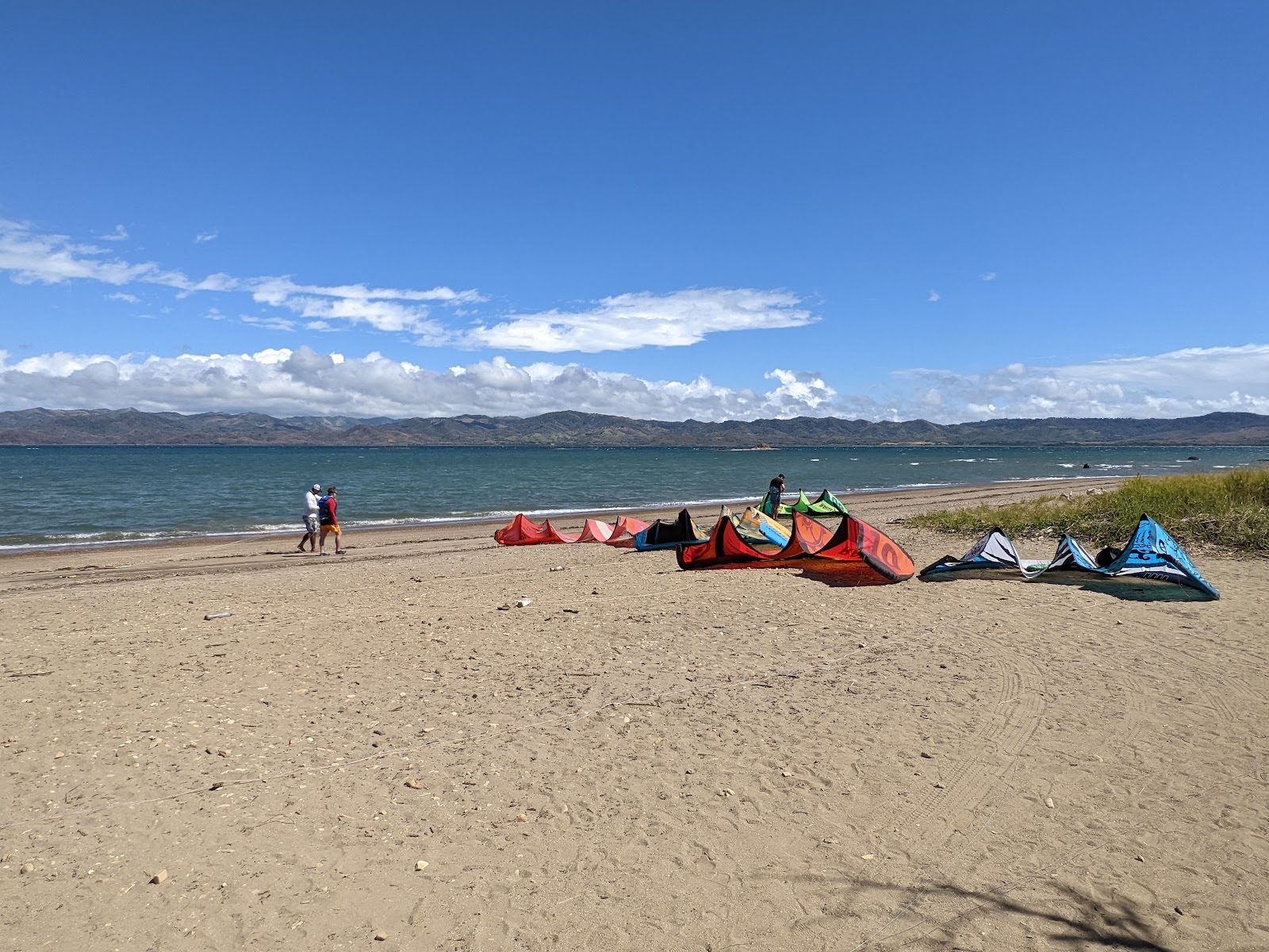 Foto von Papaturro beach mit türkisfarbenes wasser Oberfläche