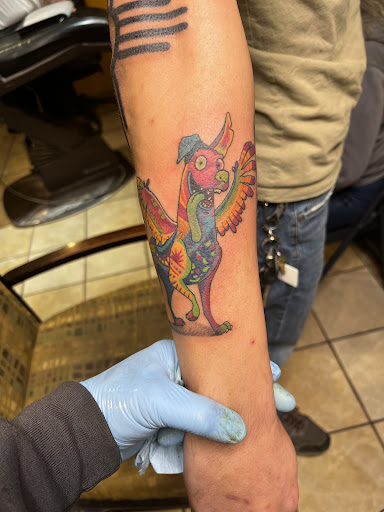 Explore weightlifting tattoos ideas, creative tattoo ideas in Las Cruces, available at Real INX Fine Art- Tattoo Piercing & Art Studio
