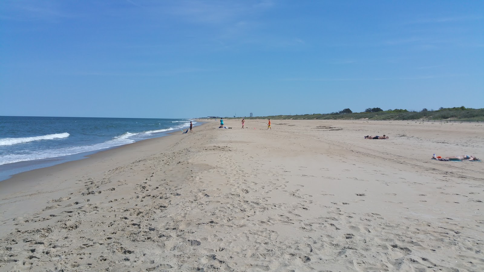 Fotografija Croatan beach z svetel pesek površino