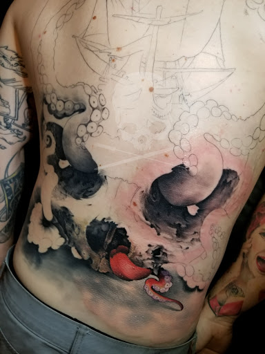 Explore arm blackout tattoo ideas, creative tattoo ideas in Birmingham, available at Revolution Ink