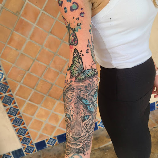 Explore female back tattoo ideas, creative tattoo ideas in Stuart, available at Tiger Shark Tattoo Studio