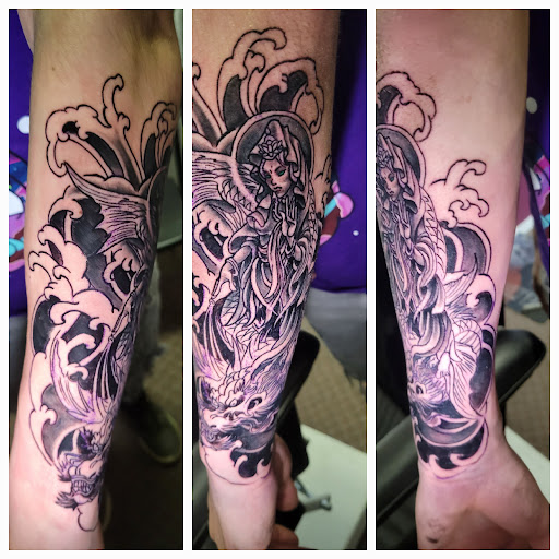 Explore dog collar tattoo ideas, creative tattoo ideas in Angola, available at Hoodlum Ink