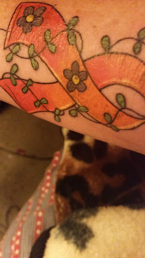 Explore elton john tattoo ideas, creative tattoo ideas in Cheyenne, available at The T.R.I.B.E. Zoo, LLC Tattoo