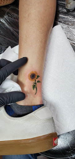 Find tattoo between breast ideas for your next unique tattoo in Reno at Evolution Tattoo