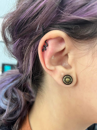 Find tattoos with letters ideas for your next unique tattoo in Nampa at Hippie Hoops and Holes