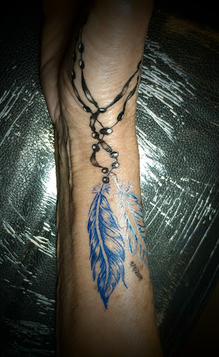 Explore flower foot tattoo ideas, creative tattoo ideas in Clintonville, available at Temple Ink Tattoo Shop
