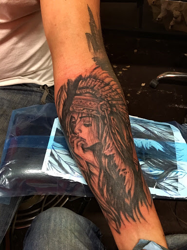 Explore lone wolf tattoo ideas, creative tattoo ideas in Rochester, available at The Ink Cartel Tattoo