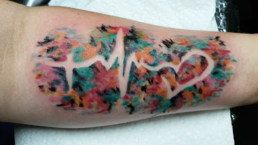 Explore nike tattoo ideas, creative tattoo ideas in Erie, available at EliKingInk