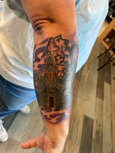 Explore snake sleeve tattoo ideas, creative tattoo ideas in Powell, available at Hummingbird Tattoo Studio