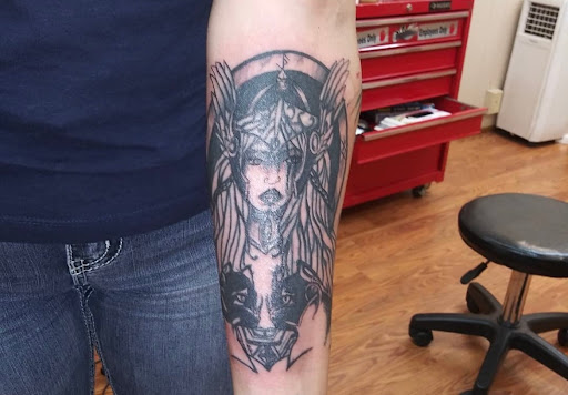 Explore tattoo cover up ideas for men, creative tattoo ideas in Charleston, available at Nemesis Tattoo and Art Gallery