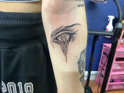 Explore leg flower tattoo ideas, creative tattoo ideas in Cocoa, available at Rorschach Tattoo Shop and Piercing Studio