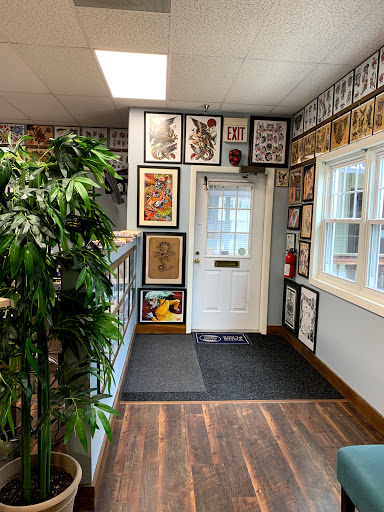 Explore snoopy tattoo ideas, creative tattoo ideas in Delmar, available at Resolute Tattoo