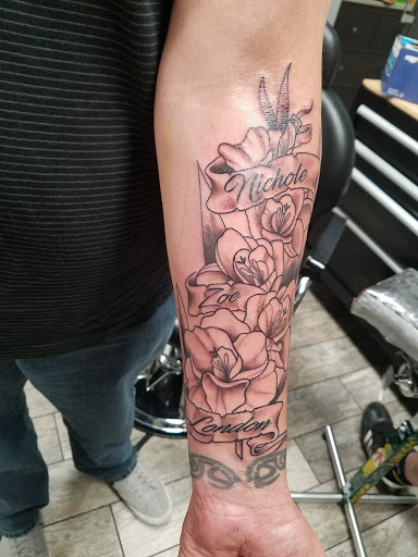 Explore orchid tattoo ideas, creative tattoo ideas in Spring Hill, available at Forever Faithful Tattoo Gallery