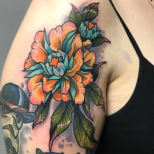 Explore women's thigh tattoo ideas, creative tattoo ideas in Edgewood, available at Evolved Body Arts