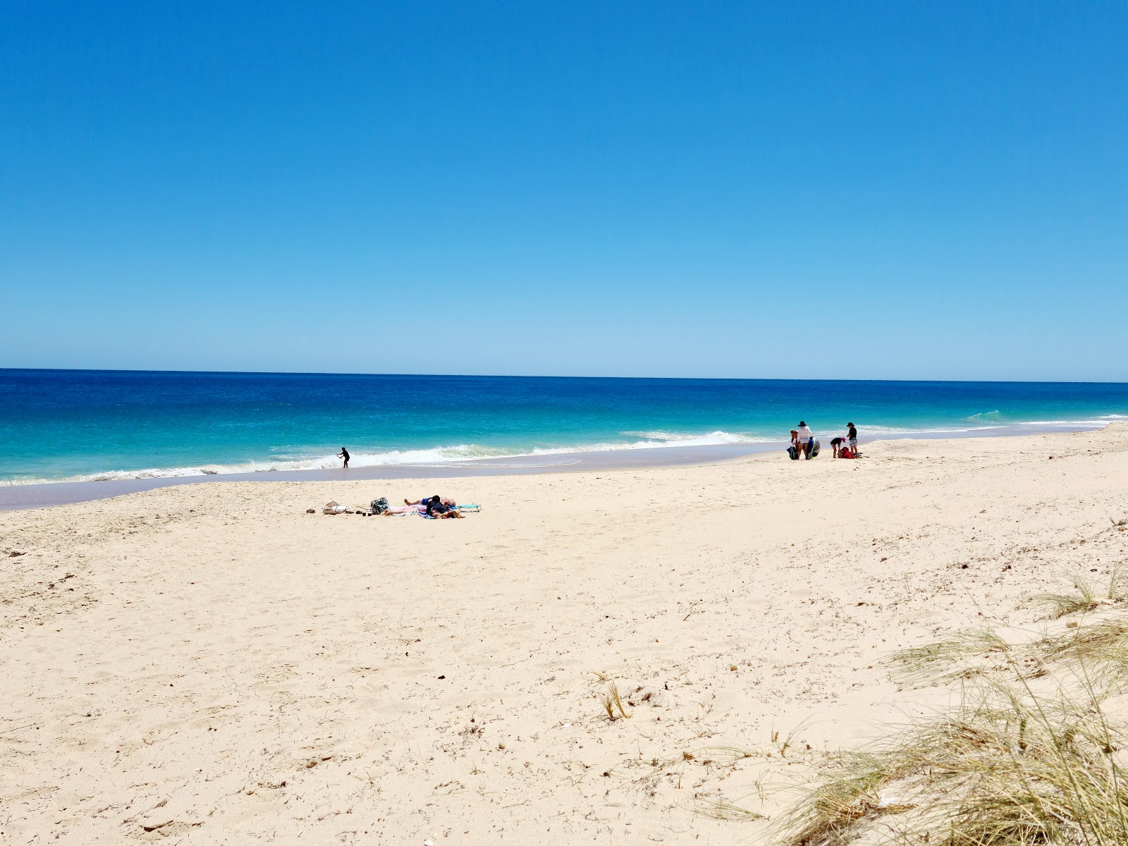 Foto av Preston Beach med beige sand yta