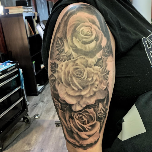 Explore october birth flower tattoo ideas, creative tattoo ideas in Clinton, available at Black Relic Tattoo