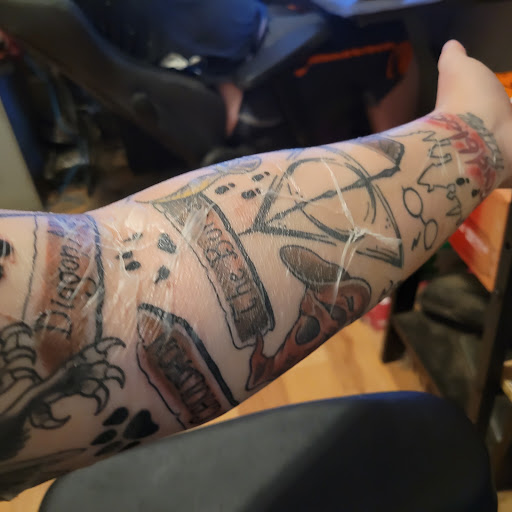Explore neck tattoos for men ideas, creative tattoo ideas in Pelham, available at Skin Worx Inc