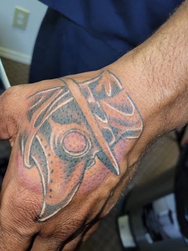 Explore abs tattoo ideas, creative tattoo ideas in Angola, available at Hoodlum Ink