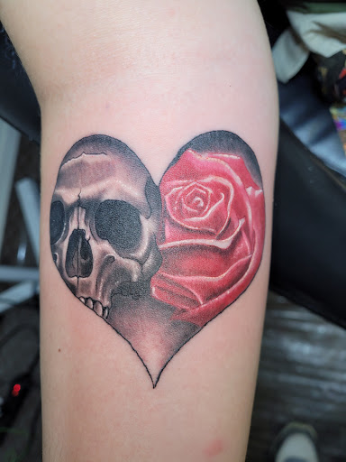 Explore chest tattoo ideas for females, creative tattoo ideas in Angola, available at Hoodlum Ink