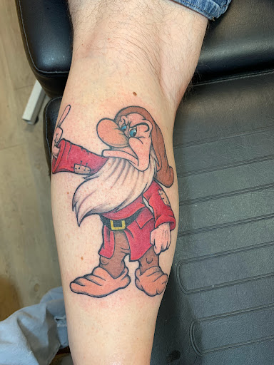 Explore hellscape sleeve tattoo ideas, creative tattoo ideas in Brunswick, available at Blue Fin Tattoos