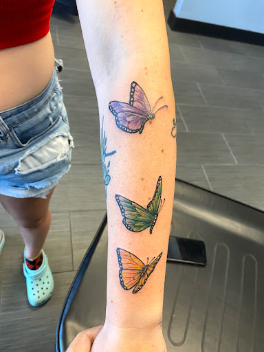 Explore black queen tattoo ideas, creative tattoo ideas in Palm Harbor, available at Angry Owl Tattoo and Piercing