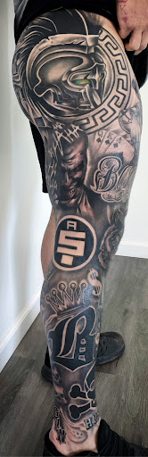 Explore leg tattoo idea, creative tattoo ideas in Belleville, available at Dark Horse Tattoo Company, LLC