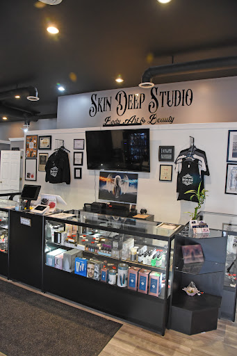 Find tattoo ideas between breast for your next unique tattoo in Roscoe at Skin Deep Studio Body Art & Beauty