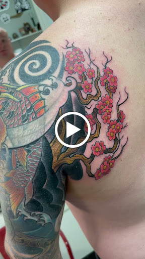 Explore cosmos flower tattoo ideas, creative tattoo ideas in Marietta, available at Monkeys Uncle Tattoo