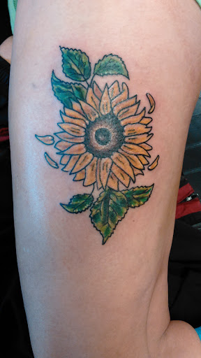 Explore spring tattoo ideas, creative tattoo ideas in Newport, available at T N T Explosive Tattoo