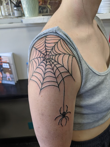 Explore tattoo ideas for neck, creative tattoo ideas in Slippery Rock, available at Dinky Dachshund Tattoo Parlor