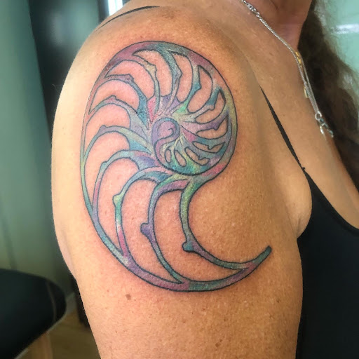 Explore ear tattoo ideas for females, creative tattoo ideas in Honokaa, available at Sea of Light Tattoo Studio