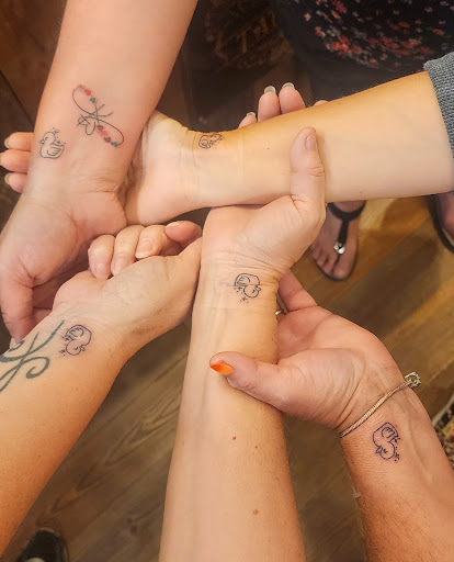 Explore tramp stamp tattoo cover up ideas, creative tattoo ideas in Sevierville, available at Jaded Art Collective