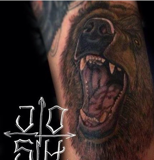 Explore snake sleeve tattoo ideas, creative tattoo ideas in Kingsford, available at Deft Tattoo Studio