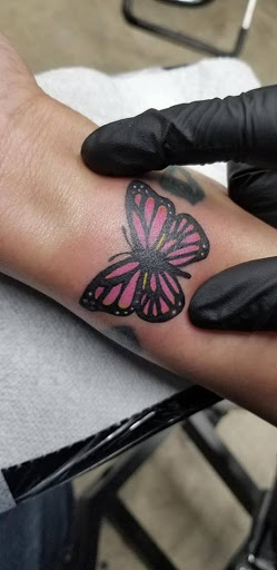 Explore cover up tattoo ideas for upper arm, creative tattoo ideas in Huntsville, available at Blessed Ink