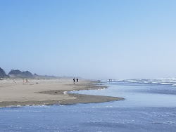 Foto av Clam Beach och bosättningen