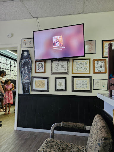 Explore bow and arrow tattoo ideas, creative tattoo ideas in Charleston, available at Nemesis Tattoo and Art Gallery