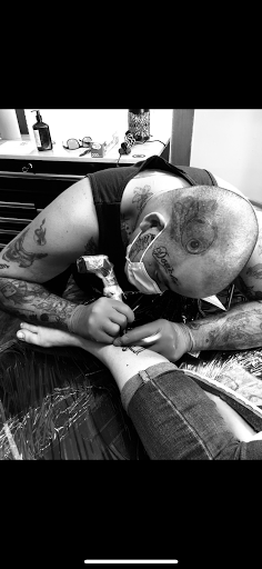 Explore elton john tattoo ideas, creative tattoo ideas in Warrensburg, available at Altered Visions Tattoo Studio